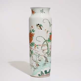 A Chinese wucai sleeve vase with birds in a blossoming landscape, 19th C.