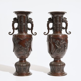 A pair of Japanese bronze relief-decorated vases, Meiji, 19th C.