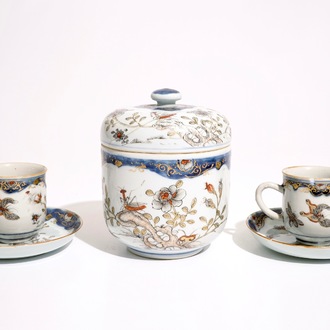 A pair of Chinese grisaille, gilt and iron red cups and saucers and a covered bowl, Qianlong