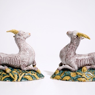 A pair of large Dutch Delft polychrome models of goats on a ground, 18th C.