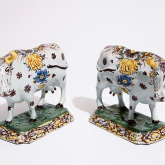 A pair of large polychrome Dutch Delft models of cows, 18th C.