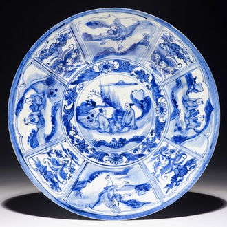 A Chinese blue and white dish with figures in a landscape, Transitional period