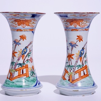 A pair of Dutch Delft polychrome petit feu Kakiemon-style vases, 18th C.