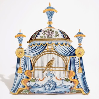 A large Dutch Delft polychrome trompe l'oeil birdcage plaque, 18th C.