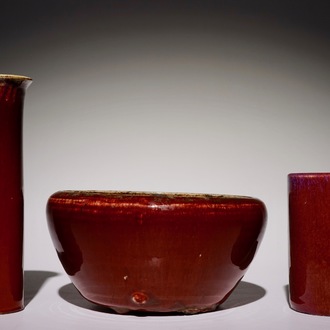 A Chinese monochrome sang-de-boeuf-glazed brush pot, a beaker vase and a bowl, 19/20th C.