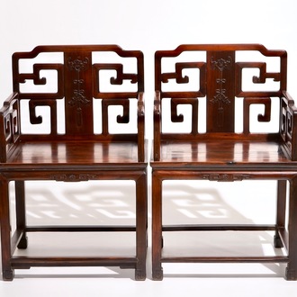 A pair of Chinese carved hardwood chairs, 19th C.