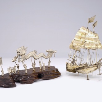 A Chinese silver model of a junk and one of a dragon parade, 19/20th C.