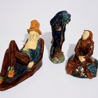 Three Flemish pottery figures of a jester, a pipesmoker and a reclining man, prob. Caesens workshop, 20th C.