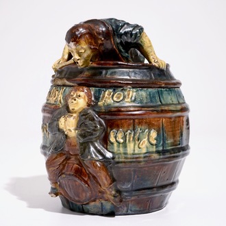 A Flemish pottery tobacco jar with a man in a barrel, prob. Vandevoorde workshop, 20th C.