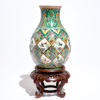 A Chinese famille verte vase with exotic animals, 19th C.