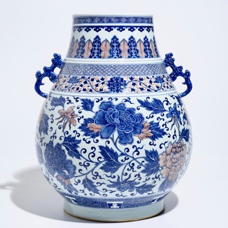 A Chinese copper-red and underglaze blue peony scroll hu vase, Qianlong mark, 19th C.