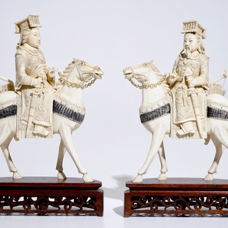 A pair of Chinese ivory warriors on horseback on wooden bases, 19th C.