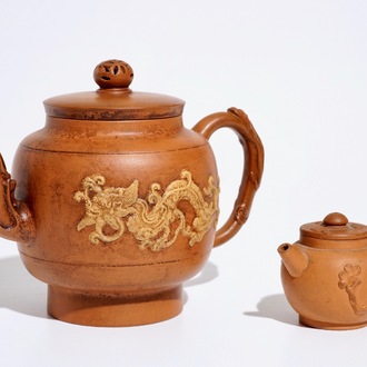 Two Chinese Yixing teapots with relief design, Kangxi and later