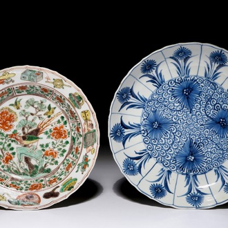 A Chinese famille verte soup plate with a pheasant and a blue and white plate with aster decoration, Kangxi