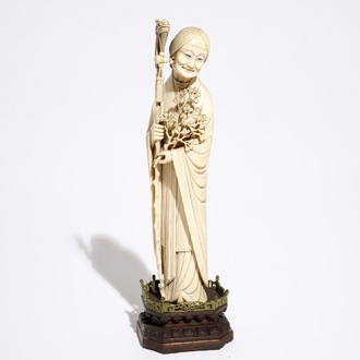 A Chinese ivory model of a lady on wooden base, 19th C.