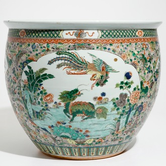 A Chinese famille verte fish bowl with a qilin and a phoenix, 19th C.