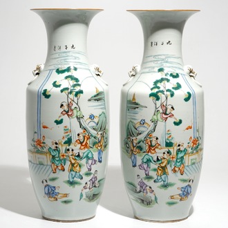 A pair of Chinese famille rose vases with playing boys, 19/20th C.