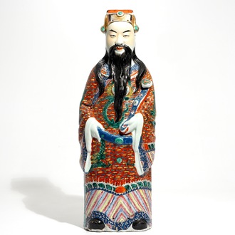 A tall Chinese famille rose figure of an immortal, 19th C.