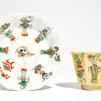 A Chinese famille verte café au lait-ground cup and saucer, Kangxi