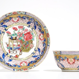 A Chinese famille rose cup and saucer with a cat, Yongzheng