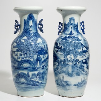 Two tall Chinese blue and white landscape vases, 19/20th C.