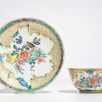 A Chinese famille rose cup and saucer with an insect on sanduo fruit, Yongzheng