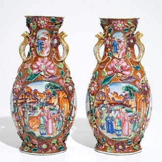 A pair of Chinese famille rose relief-decorated mandarin vases, Qianlong