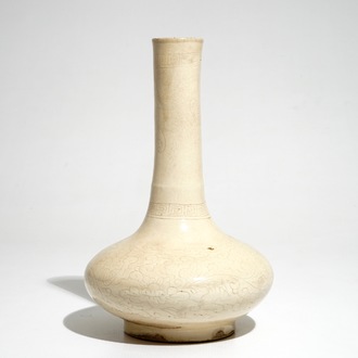 A Chinese cream-glazed bottle vase with anhua design, Song/Ming