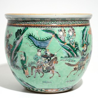 A Chinese famille verte green-ground fish bowl with warriors on horseback, 19th C.