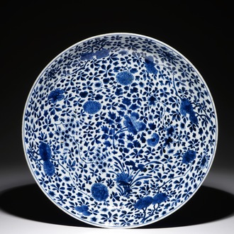 A large Chinese blue and white charger with floral design and powder blue back, Chengua mark, Kangxi