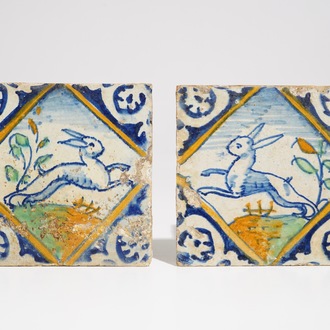 A pair of Dutch Delft mirror-decorated diamond tiles with hares, ca. 1600