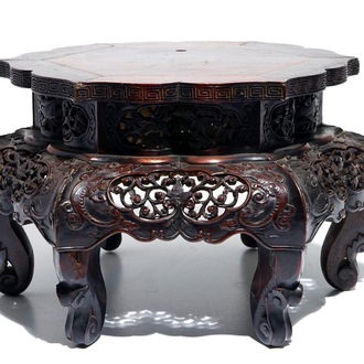 A Chinese carved wood stand with silver wire inlay, 19/20th C.