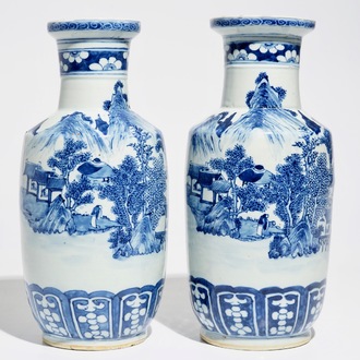 A pair of Chinese blue and white rouleau vases with landscape design, 19th C.