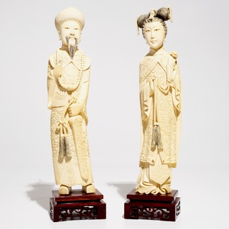 A pair of Chinese carved ivory figures of the emperor and his wife, early 20th C.