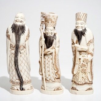 Three signed Japanese ivory okimono of bearded sages, Meiji, early 20th C.