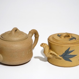 Two Chinese sand-coloured Yixing stoneware teapots, 20th C.