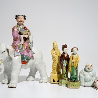 Six various Chinese famille rose and sancai-glazed figures, incl. a girl on an elephant, 19/20th C.