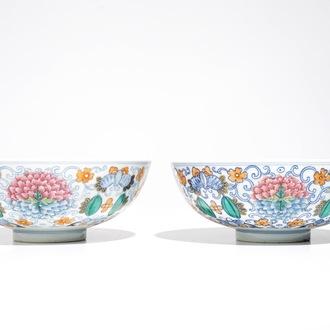 A pair of Chinese doucai bowls with floral famille rose medallions, 4-character mark, 19/20th C.