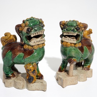 A pair of Chinese verte biscuit models of Buddhist lions, Kangxi