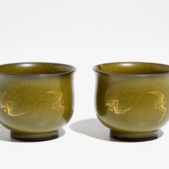 A pair of Chinese teadust-glazed and gilt wine cups with bats, Qianlong mark, 20th C.