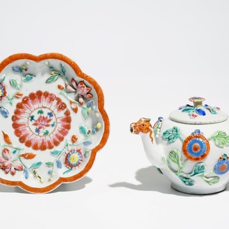 A Chinese famille rose teapot on stand with applied decoration, Yonzheng