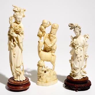 Two Chinese carved ivory figures of Guanyin and a Japanese okimono, 19/20th C.