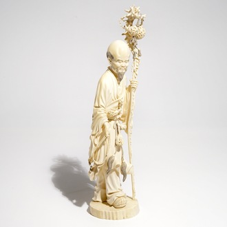 A tall Chinese ivory model of an immortal, late 19th C.