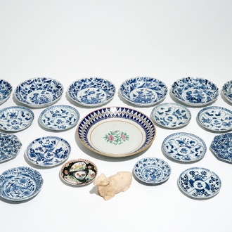 Twenty-one mostly blue and white plates, Kangxi, and a pottery model of a ram, Han dynasty