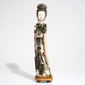 A tall Chinese polychrome ivory model of a lady with removable head, 19th C.