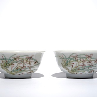 A pair of Chinese famille rose cups with flowers and butterflies, Qianlong mark, 19/20th C.