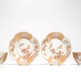 A pair of Chinese milk and blood quatrefoil cups and saucers, Kangxi