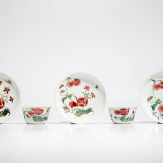 Two Chinese famille rose cups and three saucers with floral design, Yongzheng/Qianlong