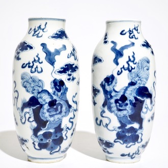 A pair of Chinese blue and white vases with Buddhist lions, Kangxi mark, 19th C.