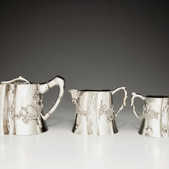 A Chinese silver teapot, milk jug and sugar bowl, Luen Wo, 1880-1940